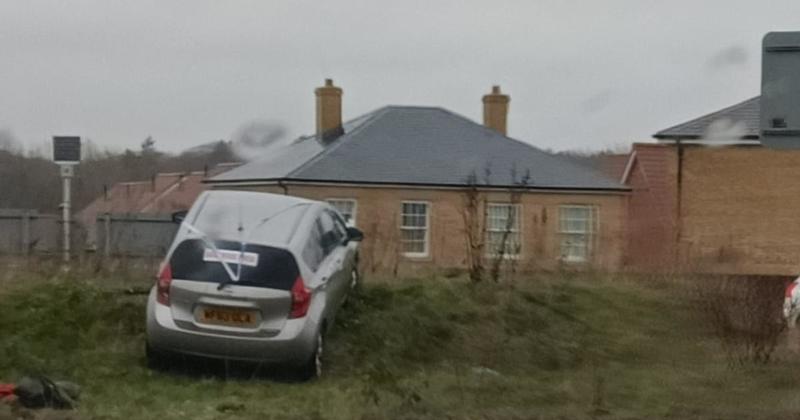 Car crashes onto roundabout at collision hotspot